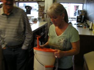 woman weighing fish